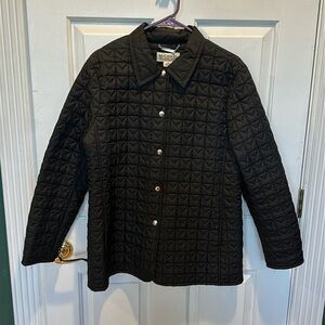 Michael Kors black quilted jacket size Large.  Full front closure with 7 snaps.